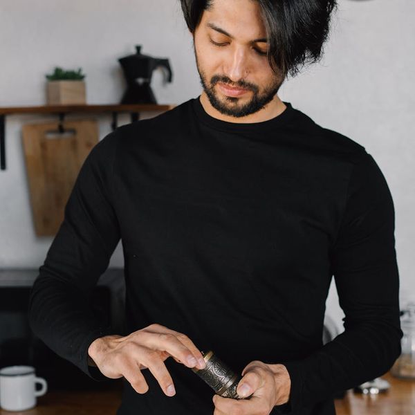 Person meditating in a serene environment, feeling energetic and balanced.